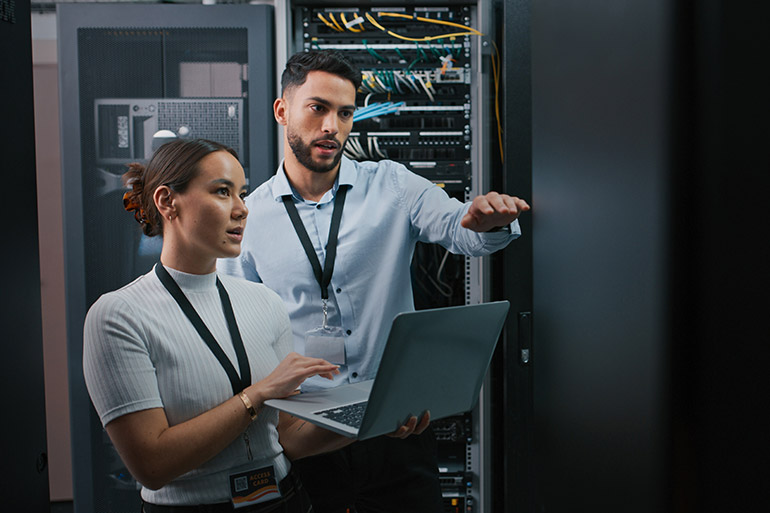 Computer Engineers with Server Rack